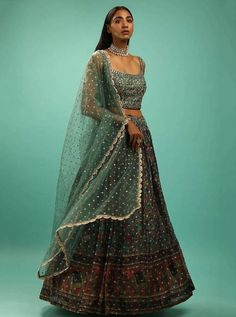 This gorgeous green silk lehenga set featuring intricate sequin and mirror embroidery is perfect to wear at best friend's wedding. The set includes an unstitched blouse, a circular lehenga with sequins work, and a net green dupatta with sequins to complete the ethnic look. #partylehenga #partywearlehenga #partylehengacholi #partywearlehengacholi Bridesmaid Lengha, Ghaghra Choli, Party Wear Lehenga Choli, Blue Lehenga, Crop Top Set