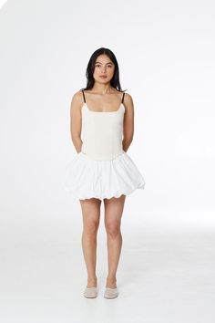 Mid-rise mini skirt with hidden bloomers and bubble hem. Crisp poplin fabric compliments any summer fit. Fit Details ✿ ✦ Fitted✦ Cotton✦ Hand wash cold, lay flat dry ✦ Model is 5'8" and wears a size S Measurements ⋱ (inches) XS S M L XL Length 12 12.5 13 14 14.5 Waist 25 27 29 31.5 34.5 See our sizing guide here ⟶ Ethical Cred ꩜ Made ethically at a women-owned and operated factory in China. Produced in a small production run, under 100 units. Designed and developed by women in NYC. Delivery & Returns 🖃 USA• Free domestic shipping details here 🔗• $40 express✓ Allow 1—2 weeksInternational • Pricing by country ⟶ ✓ Allow 2—3 weeks Returns and all FAQs here 🔗 Fitted Cotton Skort For Daywear, Summer Daywear Fitted Skort, Fitted Mini Skort For Daywear, Fitted Mini Hem Shorts For Summer, Fitted Skirted Shorts For Spring, Cotton Bloomers With Ruffle Hem For Summer, Summer Fitted Ruffled Bloomers, Summer Cotton Mini Skirt For Daywear, Spring Cotton Skort For Daywear