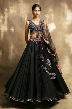 Black lehenga with embroidered waistband and seashell, metal tassel detail. Paired with geometric and floral embroidered blouse and sheer embroidered dupatta.
Component: 3
Embroidered
Neckline: V neck
Sleeve Length: Sleeveless
Fabric: Cotton, Net
Color: Black
Back and side tassel tie-up
Sequin work - Aza Fashions Red And Black Lehenga, Lehenga Black, Lehenga For Bride, Best Lehenga, Red Wedding Lehenga, Rajasthani Lehenga, Lehenga For Women, Net Skirt, Black Lehenga