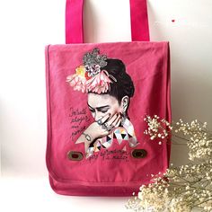 This fashionable Pink Frida Crossbody/Shoulder Bag is a unique way to pay tribute to Mexico's world famous artist, Frida Kahlo! Crafted from soft cotton canvas and featuring adjustable straps, this cute bag is perfect for the trendsetter in your life. Make it your go-to accessory or give it as a cool, original gift idea — it's a win-win! Bohemian and colorful Mexico artist' portrait with charming flowers accompanied with one of her many inspiring phrases. "Intenté ahogar mis penas pero aprendier Pink Embroidered Shoulder Bag, Pink Embroidered Bohemian Shoulder Bag, Frida Kahlo Bookmark, Frida Kahlo Earrings, Photo Studio Lighting, Pink On-the-go Bag With Zipper Pocket, Artist Portrait, Frida’s Flowers Blanket, Tall Person