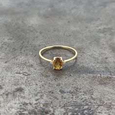 14k yellow gold petite citrine and diamond ring. 0.016cts of diamonds. Finger size 6. Yellow Topaz Center Stone Ring In 14k Gold, Yellow Gold Citrine Diamond Ring With Accents, Yellow Gold Diamond Ring With Citrine Accents, Citrine Diamond Ring With Accent Stones In Yellow Gold, Yellow Gold Citrine Diamond Ring With Accent Stones, Yellow Gold Citrine Birthstone Ring, Classic Citrine Diamond Ring In Yellow Gold, Yellow Gold Citrine Oval Diamond Ring, Oval Citrine Diamond Ring In Yellow Gold