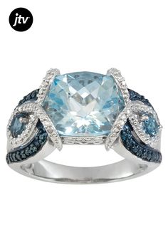 3.11ct square cushion Sky Blue Glacier Topaz��� with 0.23ctw round London blue topaz and .03ctw round blue diamond accents, 0.39ctw round white zircon rhodium over sterling silver ring. Measures approximately 3/8"L x 1/8"W. Not sizeable. Blue rhodium. Accent stones primarily zircon. Sky Blue Topaz, London Blue Topaz, London Blue, Blue Diamond, Rhodium Plated, Blue Topaz, Sterling Silver Ring, Blue Sky, Sky Blue