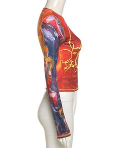 Details: Long-sleeve top with multicolor print Top Length: Cropped Sleeve Length: Long Sleeves Materials:95% Polyester + 5% Spandex Multicolor Graffiti Print Crew Neck Top, Red Stretch Tops With Graphic Print, Red Stretch Top With Graphic Print, Fitted Multicolor Fashion Print Tops, Trendy Multicolor Tops For Fall, Trendy Multicolor Tops, Red Long Sleeve Top With All Over Print, Red Printed Tops For Fall, Fitted Crew Neck Top With Graffiti Print