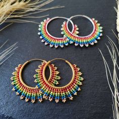 These beautiful rainbow / LGBTQ+ hoop earrings were made with high brass and quality sterling silver hoops and Miyuki beads. These hoop earrings are available in many colors. In my shop Baffling Beads AT you can find a variety of beaded jewelry pieces - I focus on earrings, hair accessories such as woven beads and bracelets. All my handmade jewelry pieces were designed and crafted by me and are completely handmade. Colorful Bohemian Hoop Jewelry, Multicolor Nickel-free Hoop Earrings For Festivals, Bohemian Rainbow Beaded Hoop Earrings, Colorful Bohemian Hoop Earrings For Festival, Rainbow Beaded Bohemian Hoop Earrings, Bohemian Beaded Rainbow Hoop Earrings, Handmade Colorful Hoop Earrings, Bohemian Rainbow Round Beaded Earrings, Bohemian Rainbow Beaded Round Earrings