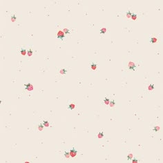 a pink wallpaper with strawberries and polka dots on the bottom half of it