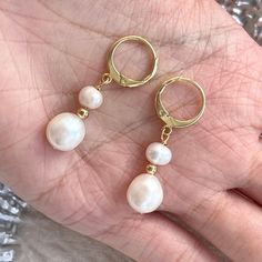 Classic dainty real natural pearl dangle earrings with gold hoop clip-on huggies. 7mm and 5mm ivory freshwater pearls have beautiful natural shine, every pearl is unique in its texture and shape, super elegant and classic. Great accessory for bridal bridesmaid wedding earrings, amazing gift idea for your loved one, they also look perfect with everyday outfit! 💎 Features: ♥ Material:14K Gold plated sterling silver, brass ♥ Main stone: 5mm, 7mm natural freshwater pearl, each pearl is unique ♥ Clip-on Closure 💎 Details: ♥ Approximate Measurements: - Length: 3.4 cm - Width: 1 cm ♥ Lightweight, easy to wear ♥ Nickel/Lead Free, Hypoallergenic, good for sensitive skins 🎁 Packing & Shipping: ♥ All our jewelry will be shipped with beautiful gift wrap packaging ♥ Handwrite gift notes/cards availa Double Pearl Earrings, Handwritten Gifts, Wrap Packaging, Natural Pearl Earrings, Bridesmaid Pearls, Pearl Dangle Earrings, Bridal Earrings Pearl, Gold Pearl Earrings, Beautiful Gift Wrapping