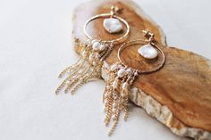 ❄️ Production times have now been extended due to the holidays, please check the estimated delivery date in your cart before ordering. If you need an order sooner than is stated please contact me to see if it will be possible. ❄️ A beautiful pair of long, boho inspired bridal earrings, made with handcrafted, textured 14k gold filled hoops, freshwater pearls, clear Swarovski crystals, high quality chains with soldered links for strength, and 14k gold filled studs with butterfly backs for security Brass Jewelry With Pearl Charm For Weddings, Bohemian Gold Plated Jewelry For Wedding, Elegant 14k Gold-filled Hoop Earrings With Dangling Charms, Handmade Gold Plated Hoop Earrings For Wedding, Elegant 14k Gold Filled Hoop Earrings With Dangling Charms, Handmade Gold Plated Wedding Hoop Earrings, Wedding Handmade Gold Plated Hoop Earrings, Bohemian Dangle Hoop Earrings For Weddings, Gold Hoop Earrings With Dangling Beads For Wedding