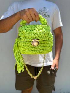 This handmade knitted green bag has a spacious interior and is a very cool piece. You can easily use this bag everywhere in your daily life. Green Knitted Bag For Daily Use, Green Knitted Shoulder Bag For Daily Use, Green Knitted Shoulder Bag, Trendy Green Knitted Shoulder Bag, Green Knitted Bags For Everyday Use, Green Knitted Bag For Everyday Use, Green Crochet Bag With Braided Handles, Trendy Green Crochet Bag With Braided Handles, Green Knitted Shoulder Bag For Everyday