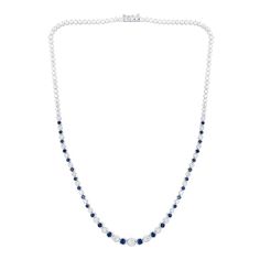 This blue lab-created sapphire and diamond tennis necklace radiates alluring beauty and classic style. 10K white gold Alternating diamonds and blue lab-created sapphires graduate in size to the largest 1/5 ct. diamond at the center 1-1/2 cts. t.w. of diamonds 16.0-inch necklace; box clasp Formal White Gold Tennis Necklace With Gemstone, Fine Jewelry Sapphire Necklaces For Anniversary, Anniversary White Gold Gemstone Tennis Necklace, Formal Cubic Zirconia Tennis Necklace With Gemstones, Classic Sapphire Necklace With Prong Setting, Classic Sapphire Necklaces With Prong Setting, Classic Blue Diamond Necklace With 17 Jewels, Anniversary Sapphire Necklace With Diamond Cut, Classic Sapphire Diamond Necklace With Brilliant Cut