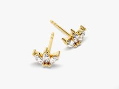 A royal earring fit for the queen. 14K gold marquise crown stud earrings are perfect accessory to add to your day or night look. A classic that will never go out of style.FEATURES• Made to Order• Gold Kt: 14k Solid Gold, 18k Solid Gold• Gold Color: Rose Gold, Yellow Gold, White Gold• Width x Height: 7.85 mm x 5.70 mm • Gemstone: Diamond• Diamond Cut: Marquise• Diamond Color - Clarity: G Color - SI1 Clarity• Number of Stones and Size: 4.00 mm x 2.00 mm, 6 pcs in total• Total CTTW: 0.60 ct tw (for Marquise Cut Yellow Gold Earrings, Yellow Gold Marquise Cut Earrings, Elegant Marquise Cluster Earrings, Elegant Gold Marquise Cut Earrings, Classic Gold Marquise Cut Earrings, Gold Marquise Cut Earrings With Prong Setting, Gold Marquise Cut Fine Jewelry Earrings, Gold Marquise Cut Earrings Fine Jewelry, Classic Marquise Diamond Earrings In Gold