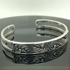 Men's Handmade Embroidered Bracelet , Handmade Cuff Bracelet , Silver Cuff Bracelet , Unisex Handmade Bracelet , 925k Silver Bracelet ★Item Details * Material : 925K Sterling Silver * Total weight : 24 Grams ✔ Ready to Ship in 1-2 Business Days .. ✔ Shipped to the Worldwide 1-5 business days with free shipping... ✔ The product will be sent to you with a handmade wooden box to avoid any damage during shipping... ✔ Visit our store, browse other Men's jewelry, silver and gold collections, and find Engraved Sterling Silver Adjustable Cuff Bracelet, Engraved Adjustable Sterling Silver Cuff Bracelet, Cuff Bracelet Silver, Embroidered Bracelet, Handmade Wooden Boxes, Cuff Bracelets Handmade, Gold Collection, Silver Cuff Bracelet, Handmade Bracelet