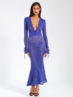 Flaunt your curves in this sexy and stylish sister to our beloved Veronica Lace Maxi Dress and Udaya Lace Long Sleeve Maxi Dress. With a flattering mermaid silhouette, deep “V” neckline adorned with scalloped lace trim, and satin ruched waistband, you're sure to make an impression wherever you go! The added bonus of shoulder pads and long sleeves with a slight flare and cute ribbon tie at the end makes this dress the perfect choice for any special occasion or night out. An invisible zipper is lo Fitted V-neck Mermaid Summer Dress, Fitted V-neck Mermaid Dress For Summer, Summer V-neck Fitted Mermaid Dress, Glamorous Fitted Beach Dress, V-neck Mermaid Dress For Night Out, Fitted Mermaid Hem Beach Dress, Fitted Mermaid Dress For Beach, Fitted Mermaid Silhouette Dress For Night Out, Stretch Mermaid Dress For Night Out