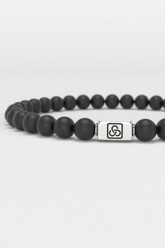 Discover the Essential Bracelet from Seekers, where minimalism meets the ethos of self-expression and refinement. This 6mm bracelet embodies the Seekers' philosophy of understated elegance, catering to the discerning individual who values both simplicity and depth in design. Its sleek onyx beads make a subtle yet impactful statement, perfect for the modern seeker who navigates life with quiet confidence and a keen sense of style. This piece isn’t just an accessory; it’s a testament to the beauty Minimalist Silver Wristband For Everyday, Everyday Silver Minimalist Wristband, Elegant Beaded Bracelets For Meditation, Classic Matte Finish Jewelry Gift, Minimalist Jewelry With 8mm Beads, Modern Adjustable White Gold Beaded Bracelets, Elegant 8mm Beads Bracelet For Meditation, Minimalist Hypoallergenic Beaded Round Bracelets, Minimalist Hypoallergenic Round Beaded Bracelets