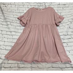 This Beautiful Pink And White Gingham Empire Dress By Haptics Is A Must-Have For Any Fashion-Savvy Woman. With Its Short Sleeves And Short Dress Length (50” Bust 35” Length) It's Perfect For Warm Weather Outings. The Dress Is Made Of High-Quality Materials (Polyester, Rayon , Spandex) That Ensure It's Durable, Comfortable, And Long-Lasting. The Empire Waist, Pockets, And Gingham Print Make It A Unique And Stylish Addition To Any Wardrobe. The Dress Is Available In A Size M, Comes From A Smoke-Fr Cute Plaid Mini Dress For Spring, Casual Gingham Plaid Dress For Spring, Casual Gingham Plaid Mini Dress, Short Sleeve Plaid Dress With Ruffles For Day Out, Cute Spring Plaid Dress, Casual Mini Length Plaid Dress With Ruffles, Casual Plaid Mini Dress With Ruffles, Casual Plaid Dress For Spring Picnic, Casual Short Sleeve Plaid Dress With Ruffles