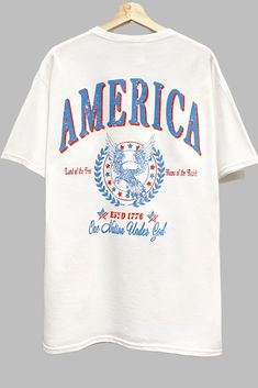 America Graphic T Shirt Retro American Flag Print Summer T-shirt, 4th Of July Cotton T-shirt With Text Print, 4th Of July Streetwear T-shirt With Letter Print, Americana Cotton T-shirt With Letter Print, Independence Day American Flag T-shirt, White Americana Letter Print T-shirt, American Style Flag Print T-shirt For 4th Of July, American Retro Summer Tops With Letter Print, 4th Of July Cotton Slogan Tops