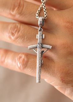 This beautiful Catholic silver cross is the perfect representation of your faith. Perfectly crafted, it is a must-have for all Catholics. Let it serve as a reminder of your beliefs. Sterling silverPendant: 61 x 23 mmBail size: 7.5 x 5.5 mmPlease note: pendant only; chain sold separatelyShown with: ROUND BOX SILVER CHAIN (2.6 MM) Processing time 1-3 business days Nickel-free Sterling Silver Cross Pendant, Nickel-free Sterling Silver Cross Charm, Spiritual Sterling Silver Cross Pendant Jewelry, Nickel-free Sterling Silver Cross Pendant Necklace, Oxidized Cross Pendant Necklace, Sterling Silver Cross Pendant Jewelry, Sterling Silver Cross Charms With Polished Finish, Oxidized Spiritual Cross Necklace, Spiritual Silver Cross Necklace With Oxidized Finish