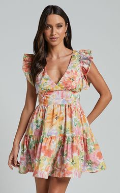 Jeanise Mini Dress - Flutter Sleeve Tiered Dress in Summer Floral Vacation Tiered Dress With Ruffle Hem And Flutter Sleeves, Floral Print Tiered Dress For Beach, Floral Print Tiered Dress For Vacation, Tiered Floral Print Dress For Vacation, Multicolor Ruffled Tiered Dress For Vacation, Flowy Tiered Dress With Ruffle Sleeves For Summer, Multicolor Tiered Dress With Ruffles For Vacation, Multicolor Tiered Summer Dress, Tiered Floral Dress For Vacation