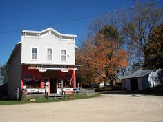 a white house with red trim on the front