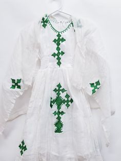 ETHIOPIAN TRADITINAL DRESS FOR KIDS ERITREAN TRADIONAL DRESS CHIC HABESHAWIT COTTO, ZURIA  Ethiopian & Eritrean Traditional clothing Green Embroidered Dress For Dress-up, White Tunic Sets For Summer, Green Embroidered Dress For Dress-up Occasions, Embroidered Long Sleeve Baptism Dress, White Short Sleeve Festive Dress, Festive White Tunic Dress, White Bohemian Short Sleeve Sets, White Long Sleeve Dress For Festival, White Long Sleeve Dress-up Sets