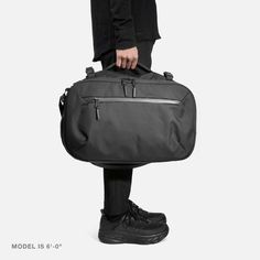 Travel Duffel - Black — Aer | Modern gym bags, travel backpacks and laptop backpacks designed for city travel Practical Large Capacity Travel Accessories For On-the-go, Functional Bags With Luggage Sleeve For Commuting, Functional Commuter Bags With Luggage Sleeve, Functional Commuting Bags With Luggage Sleeve, Versatile Duffle Bag With Functional Pockets For On-the-go, Functional On-the-go Travel Bag With Zipper Pocket, Practical Rectangular Travel Accessories With Zipper, Practical Rectangular Travel Accessories With Zipper Pocket, Multifunctional Travel Accessories With Zipper Closure