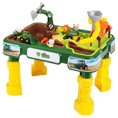 children's play table with toy farm animals and tractors