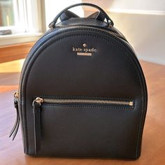 Kate Spade Black Pebbled Leather Backpack - Gold Zippers, Buckles, And Logo - Adjustable Straps - One Interior Pocket - Black Fabric Lining - 8.5” Across, 10” Tall, 4” Deep - Never Used, Like New Condition Kate Spade Versatile Bag With Zipper, Versatile Kate Spade Bag With Zipper, Chic Kate Spade Backpack For Errands, Kate Spade Backpack With Zipper Closure, Kate Spade Black Leather Backpack, Kate Spade Black Everyday Backpack, Kate Spade Backpack With Adjustable Strap For Errands, Black Leather Kate Spade Backpack, Chic Kate Spade Leather Backpack For Errands