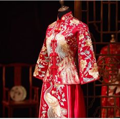 Looking a traditional Chinese bridal gown. This beautiful 2-piece qun kwa set is embroidered with gold, silver,blue and white threads. The intricate flower and peacock embroideries are decorated throughout the jacket and skirt. The peacock is a manifestation of the heavenly phoenix on earth, divinity, beauty, power, rank, and beauty. It's a perfect option for your traditional Chinese wedding, tea ceremony. Size Guide: Please refer to the size guide picture before placing the order. Please leave Traditional Gown With Floral Embroidery, Traditional Embroidered Dress With Traditional Patterns For Wedding, Traditional Embroidered Dress For Wedding With Traditional Patterns, Traditional Embroidered Dress With Patterns For Wedding, Traditional Gown With Intricate Embroidery For Ceremony, Traditional Festive Gown For Ceremony, Traditional Embroidered Dress For Wedding, Traditional Embroidered Dress For Wedding And Transitional Seasons, Elegant Embroidered Dress For Traditional Ceremonies And Festivals