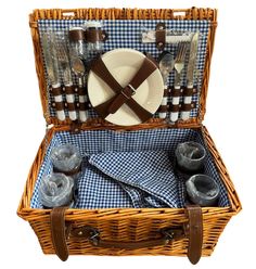 a picnic basket with utensils and plates in it