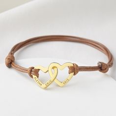 "A symbol of everlasting love, this heart interlocking mother bracelet is engraved with kids' names. ► PRODUCT INFORMATION * Material: High Quality Solid 925 Sterling Silver * Finishing: Silver, 18k Gold or Rose Gold. * Heart Dimensions: ~21/32\" (17mm) * Word limits: 2 names/heart * By default, silver items comes with BLACK engraving and gold-plated item comes with CLEAR engraving We recommend ordering a size 1/2'' to 3/4'' larger than your actual wrist size. * All of our jewelry are handmade f Engraved Jewelry For Mother's Day And Friendship, Custom Name Heart Bracelet For Mother's Day, Personalized Adjustable Heart Bracelet Gift, Custom Name Heart Bracelet For Mother's Day Gift, Mother's Day Engraved Adjustable Name Bracelet, Engraved Name Bracelet For Mother's Day, Personalized Heart Bracelet For Friendship, Customizable Adjustable Heart Bracelet For Personalized Gift, Adjustable Heart-shaped Promise Jewelry