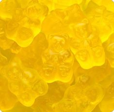 yellow gummy bears sitting on top of each other