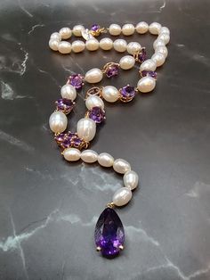 This beautiful vintage necklace is set in 14k yellow gold, has 30 shimmering pearls and 14 beaming amethyst gemstones. Luxury Purple Pearl Necklaces, Pearl Amethyst, Gold Outfit, Crystal Necklaces, Jade Bracelet, Amethyst Necklace, Emerald Ring, Amethyst Gemstone, Beautiful Bracelet