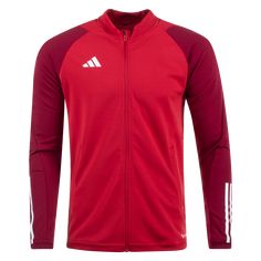 a red adidas jacket with white stripes on the sleeves and chest, in front of a