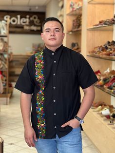 This beautiful Traditional Guayabera for Men is embroidered and adds a sophisticated flare to your wardrobe.  This elegant button up Shirt is perfect for special occasions such as Mexican Fiestas, Quinceañeras, Weddings, etc. This guayabera is handmade and completely hand embroidered by Mexican Artisans in Oaxaca, Mexico. More styles available here: https://www.etsy.com/es/shop/SoleiEthnic?ref=seller-platform-mcnav&section_id=26873542 Traditional Black Embroidered Shirt, Traditional Black Shirt With Floral Embroidery, Casual Embroidered Shirt Traditional Fit, Casual Embroidered Shirt With Traditional Fit, Traditional Short Sleeve Shirt With Multicolor Embroidery, Traditional Fit Short Sleeve Shirt, Traditional Fit Embroidered Shirt For Spring, Mexican Men, Men Formal