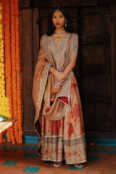 Orange handwoven soft silk anarkali featuring hand painted kalamkari and zari cutwork embroidery. Paired with an organza dupatta., Fit: Relaxed Floor-length Tussar Silk Anarkali Set With Dupatta, Diwali Meenakari Traditional Drape Palazzo Set, Festival Palazzo Set With Meenakari, Festive Meenakari Palazzo Set With Traditional Drape, Tussar Silk Palazzo Set For Wedding Navratri, Transitional Anarkali Tussar Silk Sharara, Traditional Festive Meenakari Palazzo Set, Designer Meenakari Churidar With Traditional Drape, Designer Tussar Silk Anarkali Set For Diwali