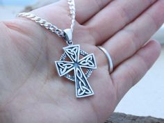 "This sterling silver pendant is just Amazing!! this Celtic Cross necklace is not just beautiful in design but also in meanings, this pendant is a symbol which emphasizes the endlessness of love of God shown through the sacrifice of Jesus on the Cross. The Celtic knot at the bottom of the cross represents friendship, affection, that cannot be broken. The trinity design on the arm of the Cross symbolizes God's love around the Holy Trinity. Also, It represents the three promises of a relationship Silver Symbolic Cross Necklace, Silver Chain Cross Jewelry, Silver Cross Pendant Jewelry, Handmade Stainless Steel Cross Jewelry, Hallmarked Silver Cross Necklace, Silver Engraved Cross Pendant Necklace, Silver Cross Necklace Stamped 925, Silver Hallmarked Cross Necklace, Hallmarked Sterling Silver Cross Necklace