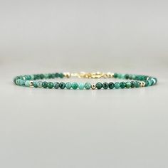 "Fall in love with our dainty emerald gemstone beaded bracelet, perfect timeless delicate minimalist design, designed to be stacked or worn on its own. Will make a thoughtful birthday, christmas. anniversary gift for your wife, mother, sister, daughter, or friend. Emerald is May birthstone- a prefect gift for someone born in May under Taurus zodiac sign. Also, perfect 20th wedding anniversary gift. Your purchase will arrive elegantly packed  in a gift-ready suede storage bag  and will include a Green Crystal Bracelet, 20th Wedding Anniversary Gifts, Minimalist Birthday, 20th Wedding Anniversary, 20 Wedding Anniversary, Taurus Zodiac Sign, Born In May, Emerald Bracelet, Bracelet Minimalist