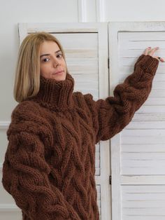 "Brown turtleneck wool sweater with a slightly loose fit, perfect for everyday styles. The chunky, long sleeve design has 3 layers of high quality wool for maximum comfort and coziness. DETAILS - The sweater has 3 layers of wool - Made from 100% wool - The sweater is knitted with 88 oz (2500 g) of high quality premium wool - The model is 170 cm tall (regular S) - The sweater on picture is size XL - As mostly all models in our shop the sweater is loose fit - Colour on photo - brown FIT - The swea Brown Cable Knit Turtleneck For Fall, Cozy Knitted Turtleneck For Cold Weather, Cozy Chunky Knit Polo Sweater For Winter, Winter Long Sleeve Chunky Knit Turtleneck, Casual Wool Turtleneck With Chunky Knit, Casual Wool Chunky Knit Turtleneck, Casual Chunky Knit Wool Turtleneck, Winter High Neck Chunky Knit Sweater, Winter High-neck Chunky Knit Sweater