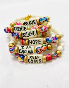 Affirmation bracelets featuring a hand-lettered affirmation focal bead and abstract print beads Stretchy to fit most wrists. Bead size - 8mm Focal bead - 18mm 7.75" centerline Beaded Bracelet Thick, Letter Bracelets Ideas, Positive Affirmation Bracelets, How To Make Bead Bracelets, How To Make Beaded Bracelets, Christian Beaded Bracelets, Letter Bracelet Beads Ideas, Beaded Bracelets Aesthetic, Word Beaded Bracelets