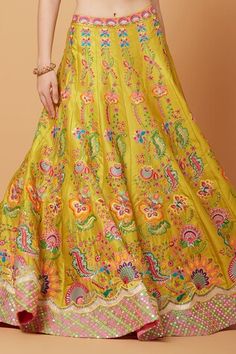 Yellow attached cancan lehenga with all over fresh gardenia embroidery using multi thread, tonal sequins, crystals, cut dana, beads highlights. Paired with a plunging scallop V neck padded blouse with bloom gardenia embroidery and neon pink mirror border embroidered net dupatta. - Aza Fashions Summer Lehenga With Cutdana In Saree Style, Summer Reception Lehenga In Saree Style, Summer Wedding Saree Set, Summer Wedding Lehenga With Zari Work, Summer Wedding Choli With Zari Work, Summer Wedding Sharara With Resham Embroidery, Traditional Summer Wedding Lehenga, Summer Wedding Set With Zari Work, Summer Silk Lehenga With Resham Embroidery