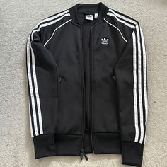 Never Used In Excellent Condition. Size: 2xs. Smoke- Free Home. Adidas Long Sleeve Outerwear With Three Stripes, Black Outerwear With Three Stripes For Fall, Adidas Three Stripes Fall Outerwear, Adidas Outerwear With Three Stripes For Fall, Adidas Black Outerwear With Three Stripes Branding, Winter Black Outerwear With Three Stripes, Urban Outerwear With Three Stripes And Long Sleeves, Long Sleeve Outerwear With Three Stripes For Spring, Fitted Outerwear With Three Stripes For Fall