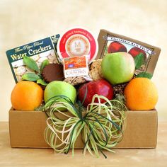 the fruit and gourmet gift box is ready to be delivered into someone's house