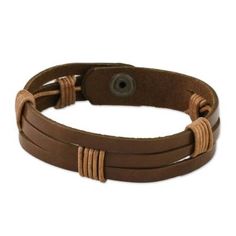 Chaloemphon of Thailand presents this men's leather wristband bracelet. The light brown leather has three horizontal slits. The artisan has wrapped two sections in black leather cord in artful intervals adding to the bracelet's texture and visual impact. The bracelet closes with a brass snap. Adjustable Brown Band Bracelet, Brown Waxed Finish Bracelet, Brown Leather Strap Wristband, Adjustable Vintage Brown Bracelet For Gift, Adjustable Vintage Brown Bracelet As Gift, Adjustable Brown Leather Bracelet With Wrist Strap, Adjustable Vintage Brown Bracelets As Gift, Adjustable Brown Wristband With Bracelet Strap, Adjustable Brown Bracelet With Wrist Strap