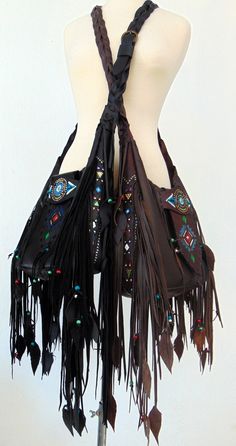 Black Handmade Crossbody Leather Bag. Native American inspired Handmade Leather Fringed Handbag. Genuine Leather. Crossbody or Shoulder Bag depend your mood !! Beautiful Ethnic Handbag with Fringes and Beads. Painted with Native American Symbols-Desings- embroidered with nice colors! Both side of the Bag are Fringed and decoraded with beats-(you can ad your personal charms if you want). I enjoy every moment creating this exceptional Bag. Become better with hard use. I wish that who ever purchase Artisan Leather Shoulder Bag For Festival, Brown Hobo Bag For Festival, Handmade Brown Shoulder Bag For Festivals, Hippie Brown Hobo Bag For Festivals, Brown Shoulder Bag For Festival, Handmade Leather Shoulder Bag For Festivals, Handmade Multicolor Hobo Bag For Festivals, Bohemian Hobo Bag For Festivals, Bohemian Brown Shoulder Bag For Festival