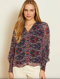 Our gorgeous Flora Top in the Kaleidoscope Leaves print. This long-sleeved blouse offers romantic elegance with soft, billowy sleeves, smocked cuffs, and a deep V-neckline. Made from luxurious viscose chiffon, it drapes beautifully. The Kaleidoscope Leaves print features blues and purples in a striking artistic design. A must-have for the modern woman, the versatile Flora Top combines romantic and timeless style. Billowy Sleeves, Hair Socks, Diff Eyewear, Leaves Print, Summer Soiree, Loungewear Shorts, Matching Dresses, Scarf Hairstyles, Leaf Prints