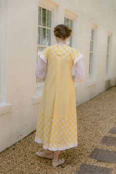 Item Details RARE, Iconic London fashion designer Gina Fratini 1970s yellow gingham picnic dress. Three quarter puff sleeve, scalloped eyelet trim. Measurements Model is a size small. Bust 33.5 Waist 38 ( empire ) Hip 40 Shoulder 14 Length 49 Condition excellent. Retro Yellow Dress For Picnic, Vintage Gingham Dress For Spring, Gingham Vintage Dress For Spring, Spring Vintage Gingham Dress, Yellow Vintage Summer Dress For Daywear, Spring Yellow Vintage Dress For Daywear, Yellow Vintage Dress For Spring Daywear, Yellow Vintage Dress For Summer Daywear, Gingham Picnic