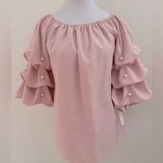 3/4” Puffy Ruched Sleeves Off Shoulder Top Elastic Detail On Shoulder And Sleeve Pearl Accents On Sleeves Laying Flat: - 18” Pit-Pit - 21.5” Length Bin# 10 Bag# 1-0356 Trendy Pink Top With 3/4 Sleeves, Trendy Pink Tops With 3/4 Sleeve, Elegant Pink Blouse With 3/4 Sleeves, Spring Party Blouse With Half Sleeves, Elegant Pink Tops For Brunch, Pink Feminine Blouse For Brunch, Feminine Pink Blouse For Brunch, Chic Pink Half-sleeve Blouse, Chic Pink Half Sleeve Blouse