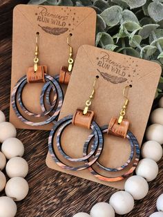 Wood and Faux Leather Earrings: Make a statement with these beautiful boho earrings for women. These wooden dangle earrings are a perfect gift for your best friend or a wonderful birthday gift for your girlfriend. The colorful wooden circles come in an array of fun colors and paired with a light brown faux leather and gold colored stainless steel hardware.  Size:  *Pendant Size: 1.5 inches *Dangle Size: 2.5 Inches Material:  *Hardware: Gold Colored Stainless steel that is great for sensitive ear Cheap Bohemian Leather Earrings, Wood And Leather Earrings, Boho Earrings Hippie Bohemian, Wood Jewelry Diy, Earring And Necklace Set, Wood Dangle Earrings, Boho Earring, Earthy Jewelry, Laser Cut Jewelry