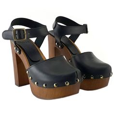 a pair of black high heeled shoes with wooden platform and metal studded straps