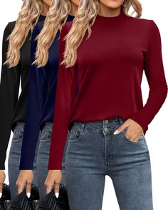 three women wearing long sleeves and jeans