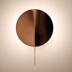 a circular light fixture mounted on the wall